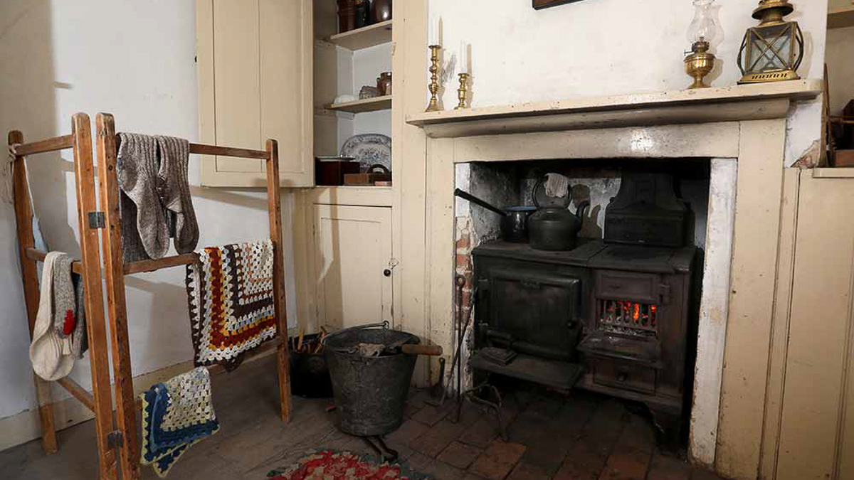 Room in the Living Museum, fire and clothes on airer, Theobolds day trip